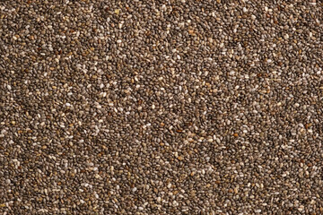 Chia Seeds Wallpaper. Raw Chia Seeds Surface. Close Up, Top View, Macro. Superfood. Full Frame. Food Background. Shiny textured White, Gray and Brown Chia. Paleo Diet Concept.