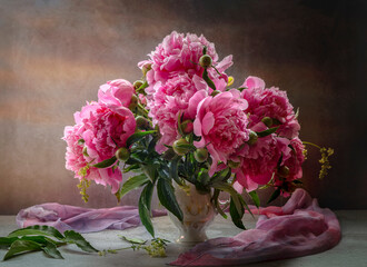 Still life with pink peonies on a dark background