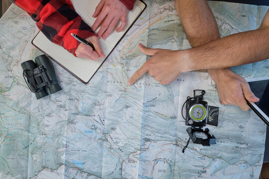 Anonymous traveling couple planning trip in camper