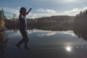 Slackline over water. Waterline in a beautiful picturesque place