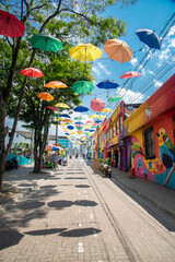 Pereira, Risaralda, Colombia. February 3, 2022: The famous meeting street in the city decorated with colored umbrellas.