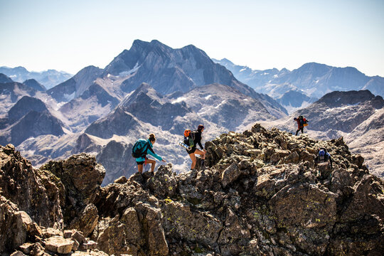 Traveling Friends Climbing Rocky Peak