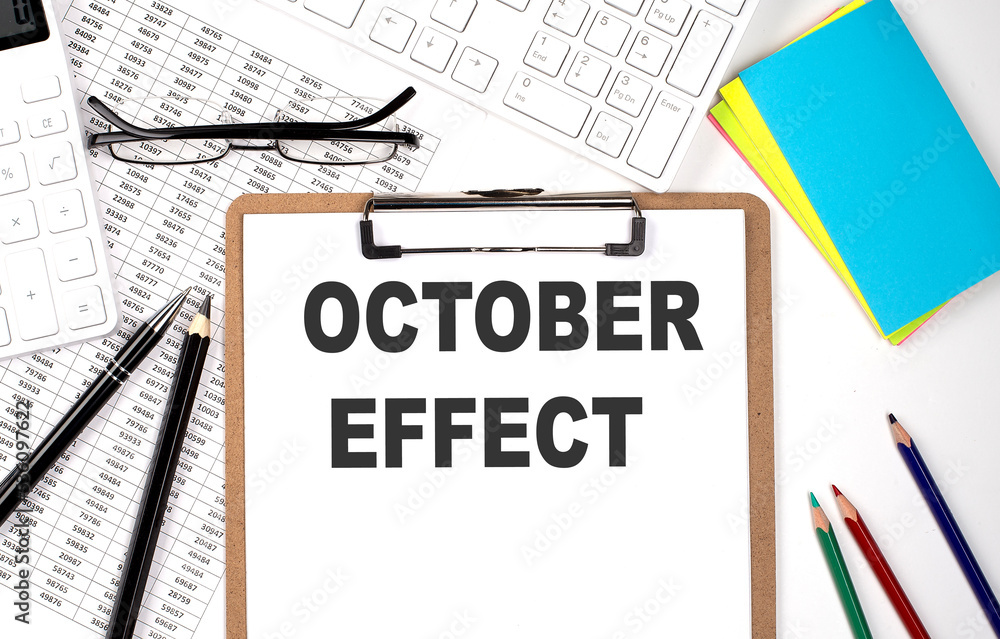 Aufkleber october effect text on paper sheet with chart,keyboard and calculator