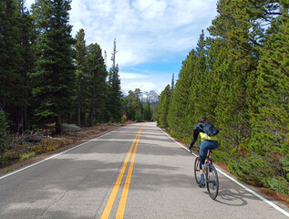 Person riding a bicycle in the mountains.