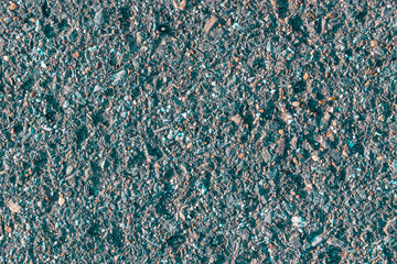 texture of old asphalt with greenish-red patches
