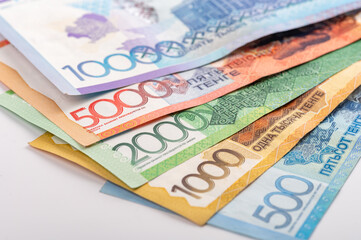 Kazakhstan money - tenge. 500, 1000, 2000, 5000, 10000 banknotes. Close up of tenge on white background.