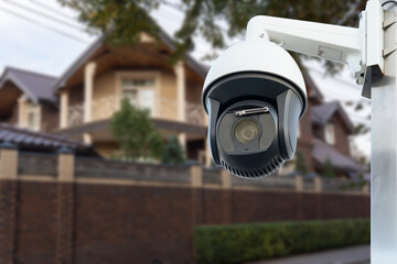 Security camera and private house on the background.