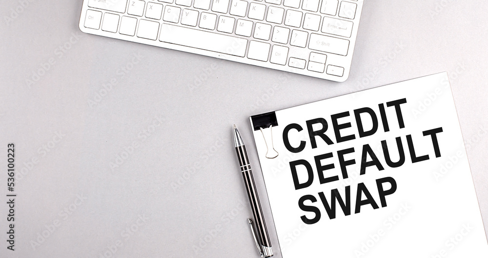 Poster cds credit default swap text on paper with keyboard on grey background