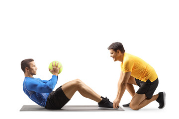 Obraz na płótnie Canvas Male athlete exercising with a fitness coach
