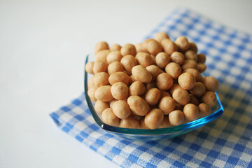 indonesia peanuts in a bowl on table top down .