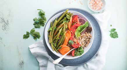 Vegetarian poke salad or Buddha bowl  for championship with buckwheat, green beans, tomatoes,...