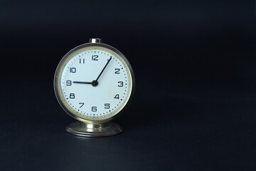 Vintage golden desk watch on black isolated background. Atatürk death anniversary concept idea. Ataturk had died in 10 Kasım 1938 09:05. Selective focus planning