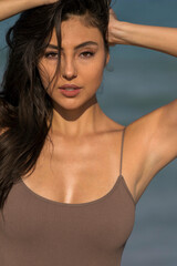 Naklejka na ściany i meble Lovely Mixed Race Bikini Model Posing Outdoors On A Caribbean Beach
