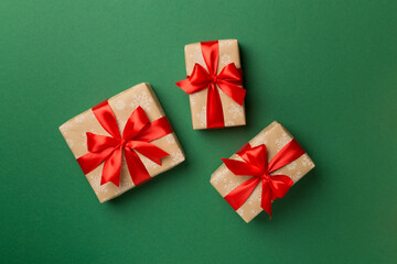 Christmas gift boxes on color background, top view