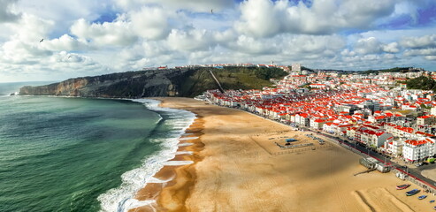 nazare portugal panoramic view on beach - obrazy, fototapety, plakaty