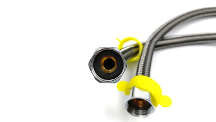 Braided water hoses for connecting faucet in sink to home water supply during plumbing work.