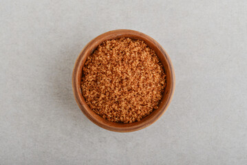 Brown sugar in wooden bowl