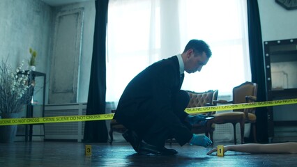 Detective Collecting Evidence in a Crime Scene. Forensic Specialists Making Expertise at Home of a Dead Person. Homicide Investigation by Professional Police Officer.