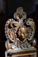 Koge, Denmark  Hand-varved and wooden ornaments on a church pew at the Koge Church.