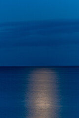 Obraz premium Mon, Denmark A moonrise over the Baltic Sea