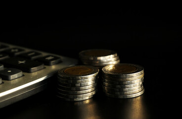 Stack of coins on black background, Saving money concept