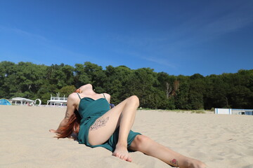 beautiful girl in a dress on the beach