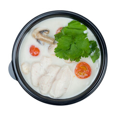 tom kha soup with chicken, mushrooms and tomatoes on black bowl isolated on white background top view