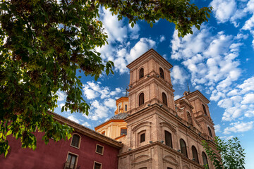 Fototapeta na wymiar Brick rear facade of the Church of Santo Domingo located in the square of the same name in the city of Murcia, Spain