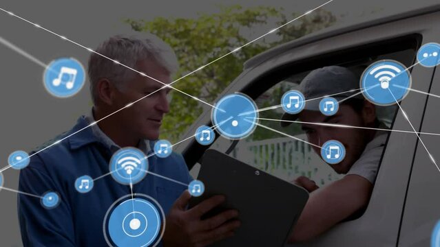 Animation of icons connected with lines over caucasian man showing clipboard to driver in van