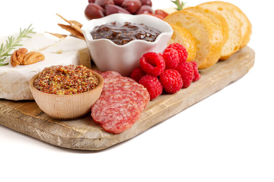 A Meat and Cheese Charcuterie Board on a White Background