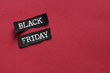 Fototapeta na wymiar Black Friday words written on a piece of paper. Time for promotions and sales in stores.