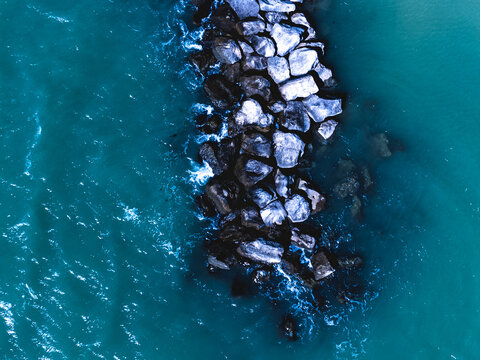 Waves Crashing Against Rocks.