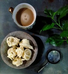 cup of coffee with crispy snack