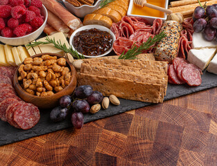 Meat Cheese and Fruit Charcuterie Board on a Wood Butcher Block