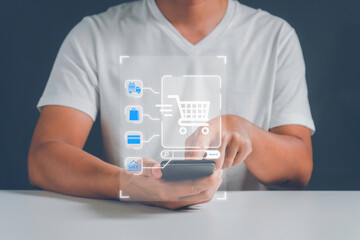 A man paying and shopping online with smartphone application at home. Digital money transfer, banking and e commerce concept.Mobile payment with wallet app technology.