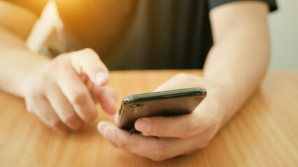 Close-up of a businessman's hand using a smartphone Search concept or social network