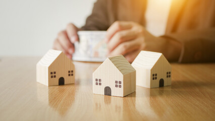 New property owner which pays with dollars on a blurred background