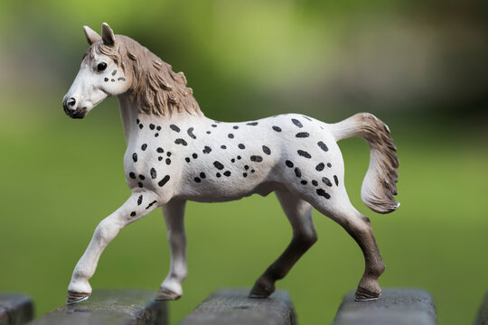 Russia. Kuzbass. A children's toy in the form of a horse of the Knabstrup breed. This is a Danish horse breed with an unusual white coat color with a variety of shades and variations of dark spots.