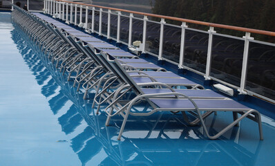 Sunbeds abandoned by passengers in a rain day