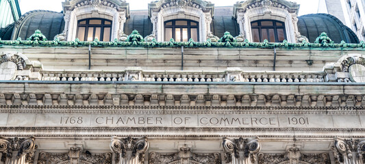 Facade of the chamber of commerce building in the financial district of Manhattan