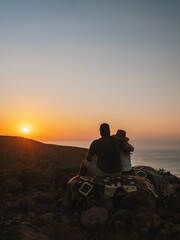 Couple watching the sunset, Baja California, Mexico
