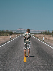 Obraz premium Men walking on the road, San Juan de la Costa, Baja California, Mexico