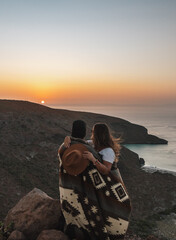 Couple watching the sunset, Baja California, Mexico