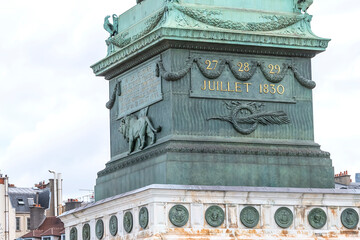 Fragments of July Column (Colonne de Juillet, 1840) with Genie de La Liberty at top on Place de la Bastille. Paris, France.