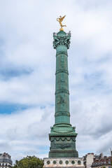 Fototapeta premium Fragments of July Column (Colonne de Juillet, 1840) with Genie de La Liberty at top on Place de la Bastille. Paris, France.