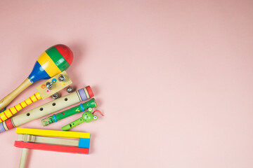 Children's musical instruments. Wooden toys. Whistles, rattle, percussion instrument and clacker in...