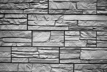 Black and white brick wall background. Detail of a Black and white brick wall texture.