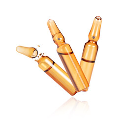 Three medical or cosmetic ampoules close-up  isolated on a white background