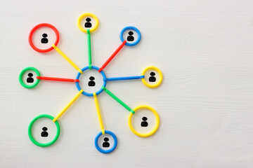 Concept image of unity and teamwork. People icons tied together as a symbol of strength and partnership