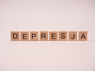 Depresja - napis z drewnianych kostek 